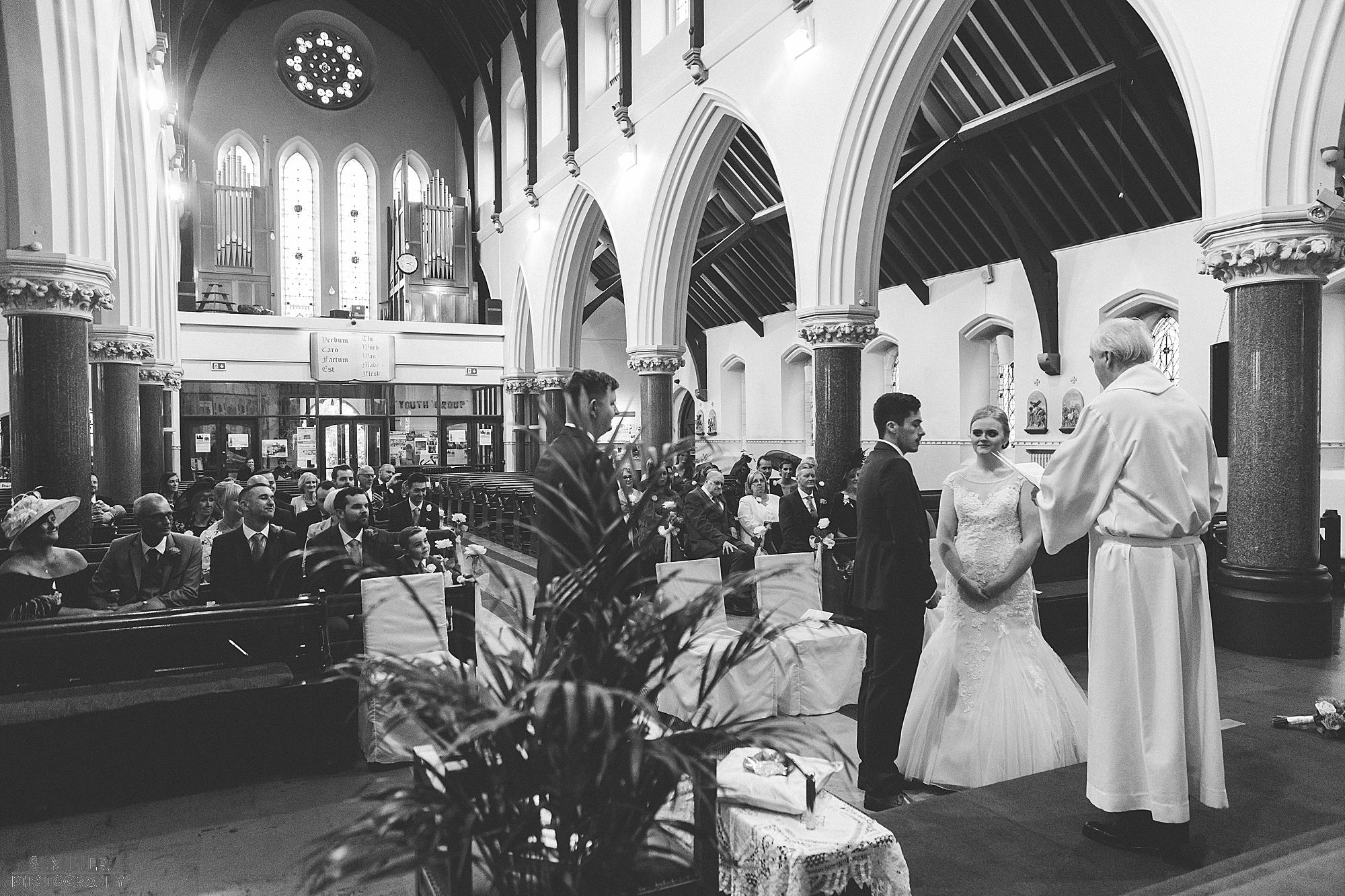 priest conducting wedding ceremony Blessed Sacred Church Liverpool