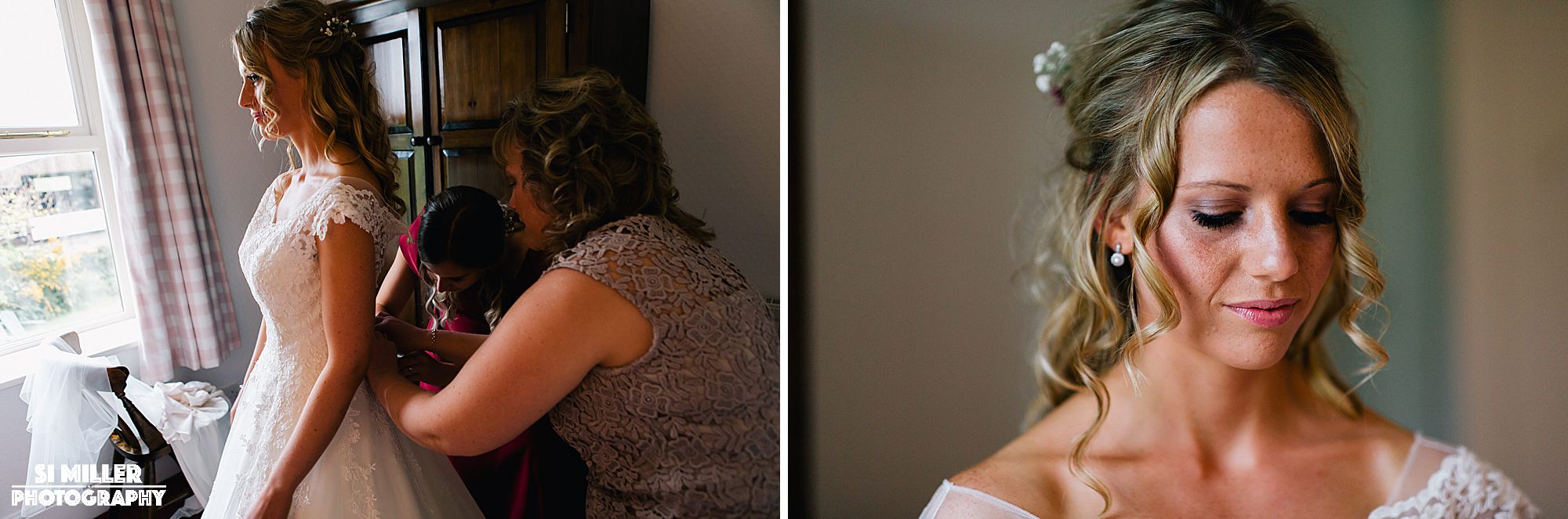 bride getting fastened into her wedding dress by mother 