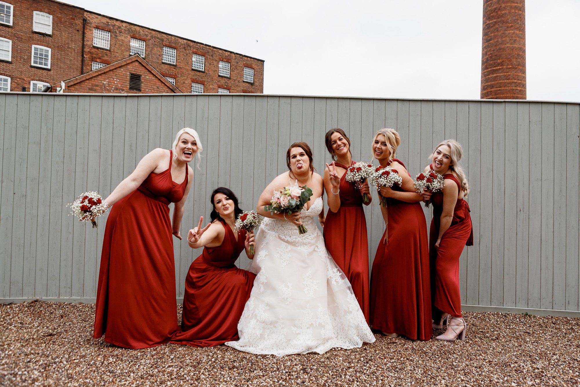 Bride and bridesmaids photo outside west mill