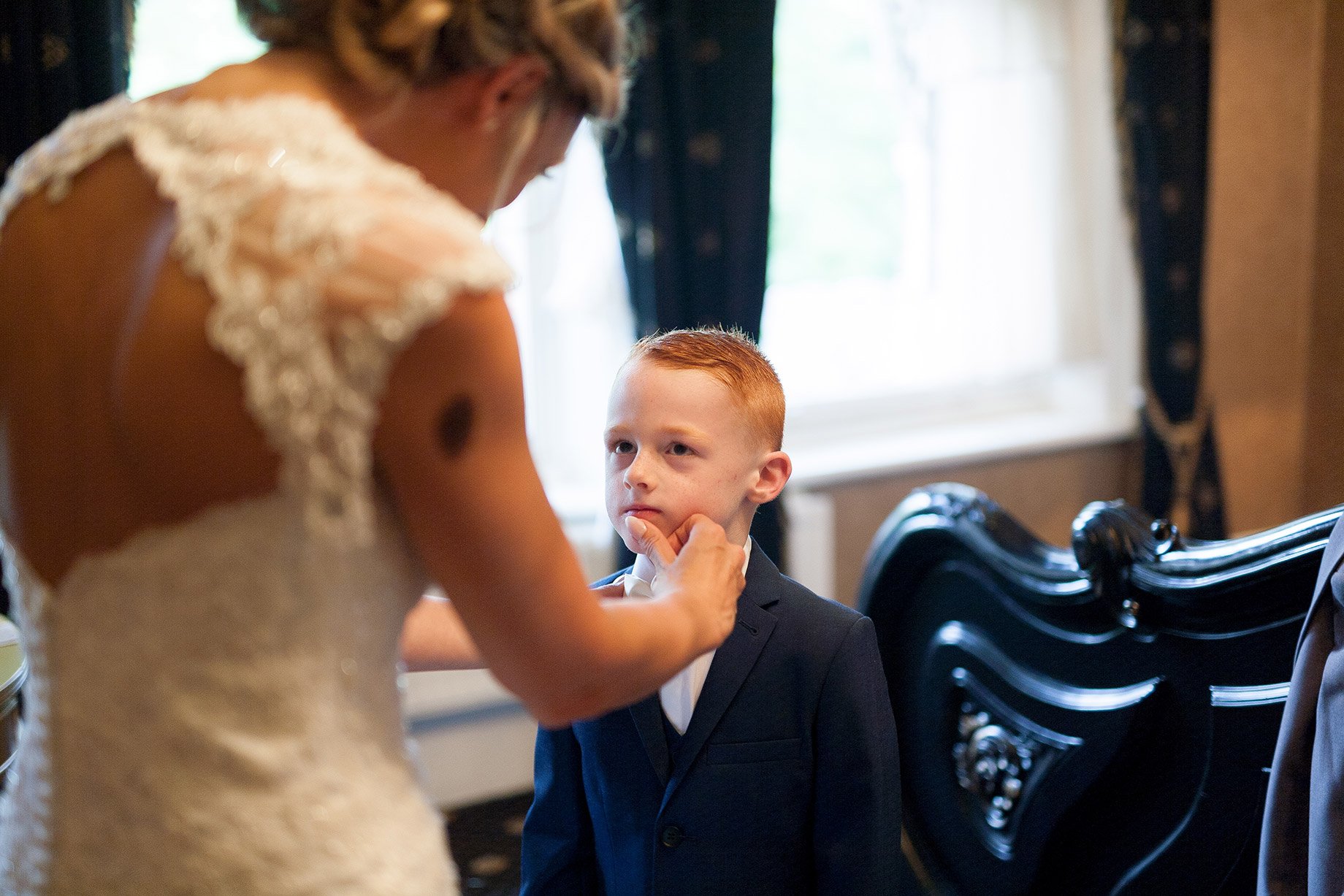 Bride cleaning Paige boys face at  Liverpool Sefton Park Sure Hotel